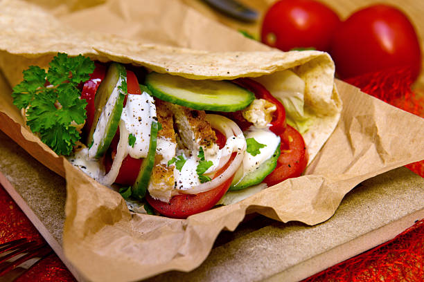 istock Tortilla wrap with chicken breast and vegetables. 507955630