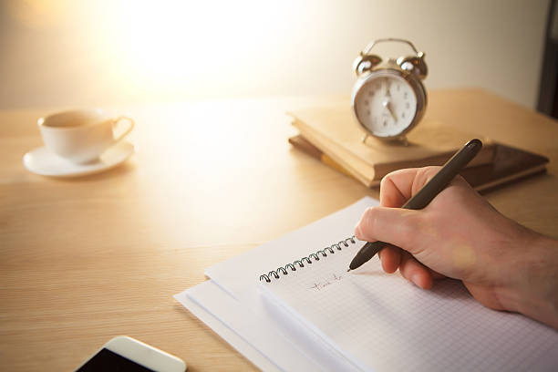 istock The male hand with a pen 507955674