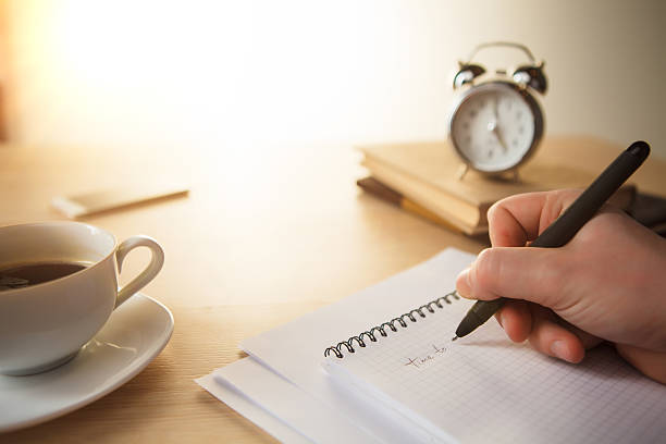 istock The male hand with a pen 507955702