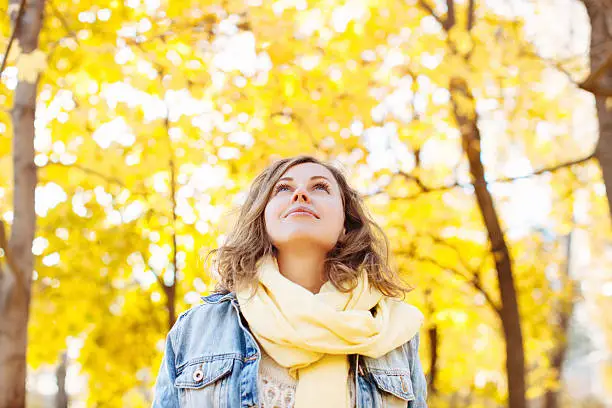 Photo of Beautiful woman in autumnal park