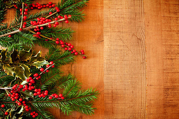 istock Christmas Holly Detail on Rustic Wood Background with Copy Space 507956013