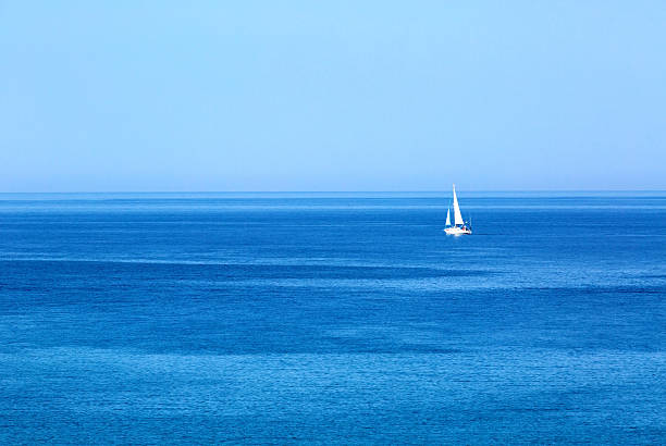 istock Sailing. Ship yacht with white sails in the open Sea 507956584