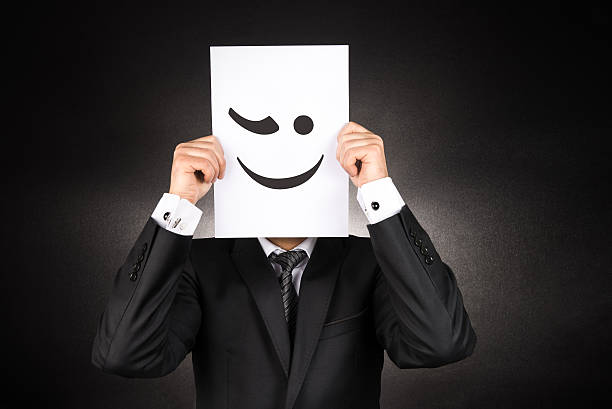 istock Businessman holding blinking emoji 507958040