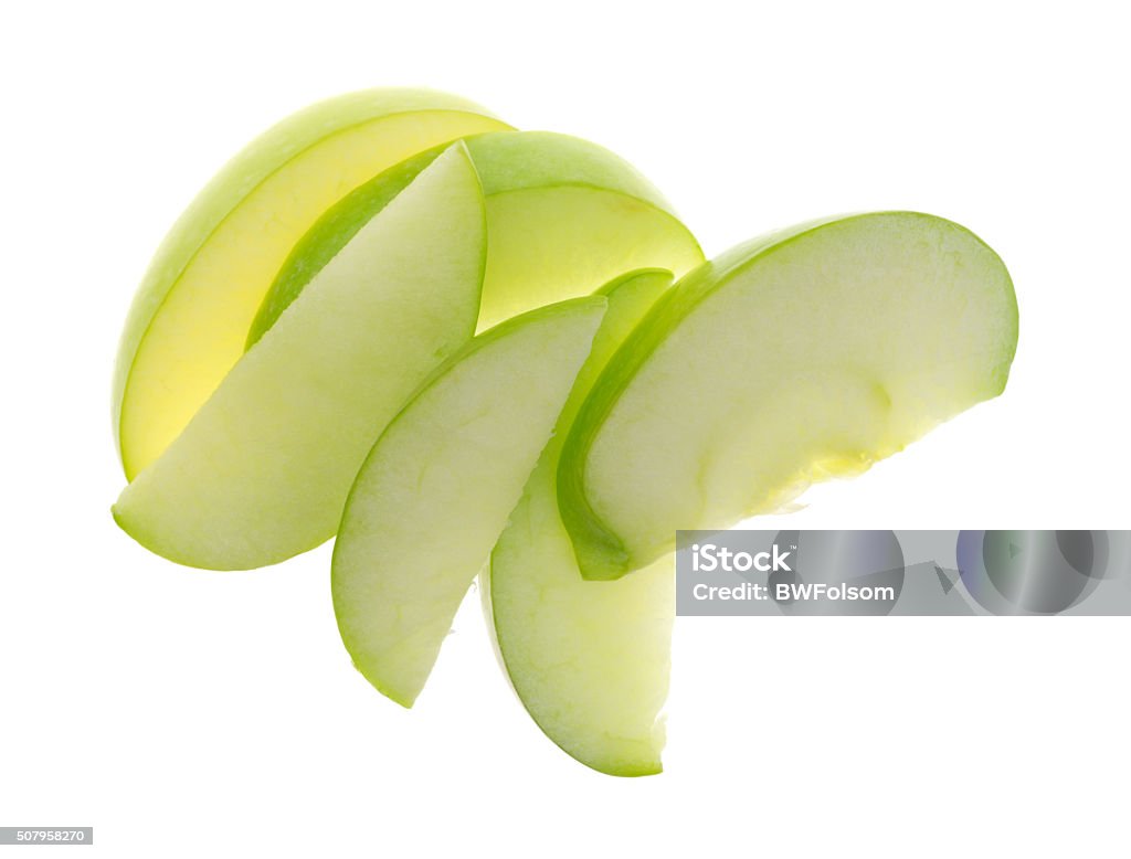 Green apple slices on white background top view Top view of a group of green apple slices isolated on a white background. Apple - Fruit Stock Photo