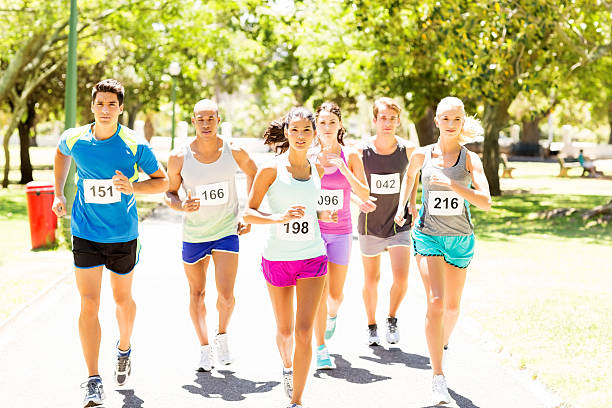 istock Male And Female Competitors Running Marathon 507958277