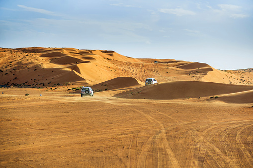 Dubai, United Arab Emirates - 24 November 2021: Desert safari with Dune bashing by a 4x4 car is a very popular activity.