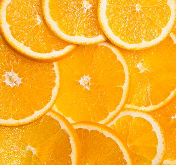 istock slices of oranges laid out in the form background 507958882