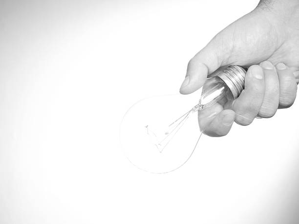istock Hand holding an incandescent light bulb 507958974