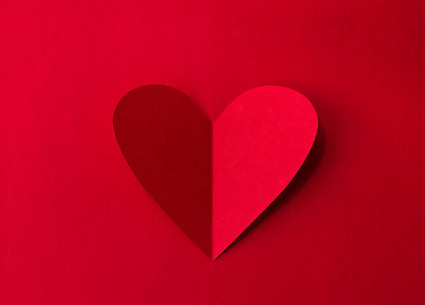 istock Paper heart on red background 507959956