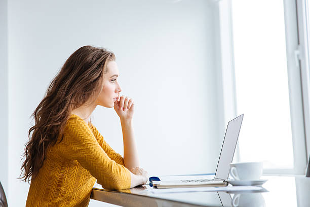 istock Thoughtful woman sitting at the table 507960430