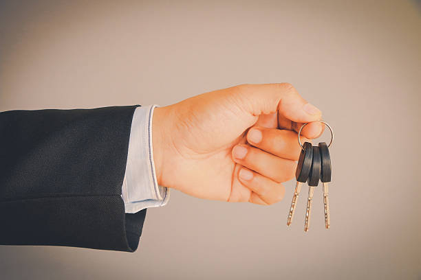 istock Business man hand holding keys 507964584