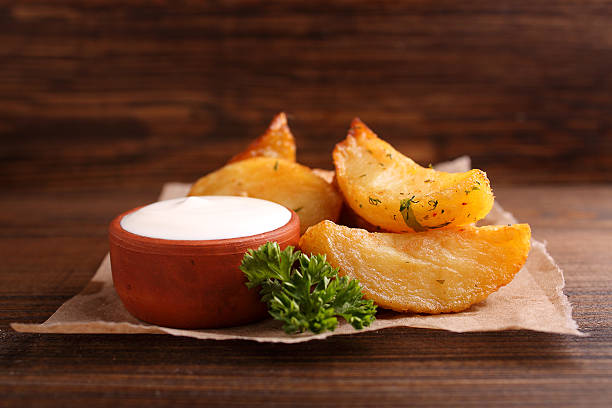 istock baked potatoes with spices and sour cream 507964828