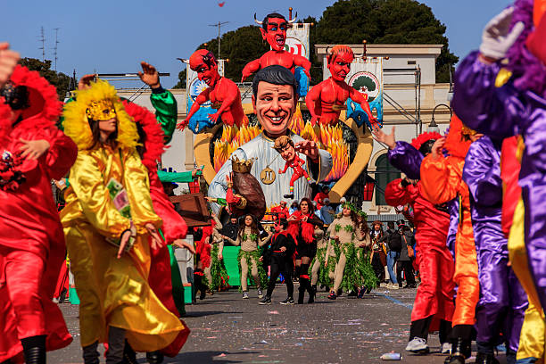 Carnival Putignano: floats. Italian politician: Matteo Renzi. ITALY(Apulia) Putignano,Apulia,Italy - February 15, 2015: carnival floats, giant paper mache.Giants italian politicians: Matteo Renzi. painted masquerade masks stock pictures, royalty-free photos & images