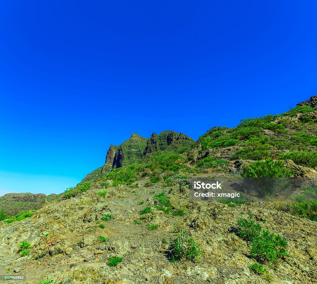 Mountains on Tenerife Island in Spain Mountains landscape on Tenerife Canary island in Spain at Sunny Day with Blue Sky Atlantic Islands Stock Photo