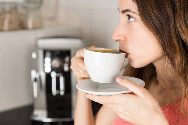 istock Profile of coffee drinking woman 507967034