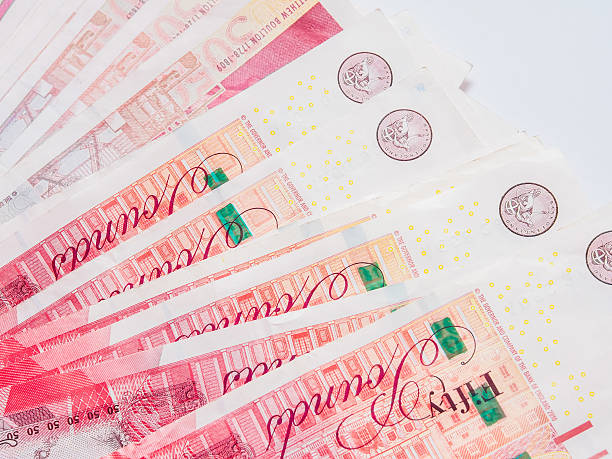istock Spread of pound money close up 507968598