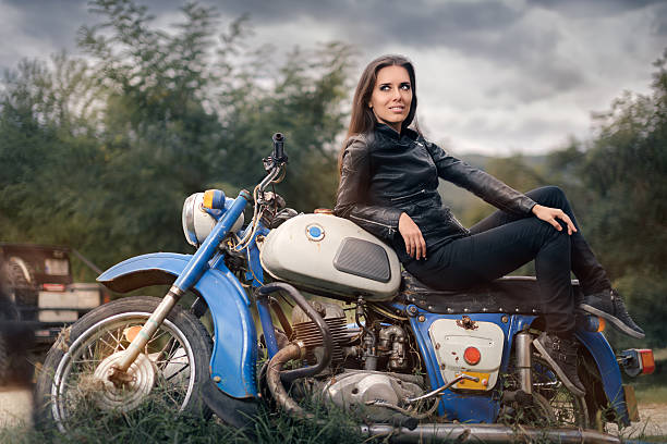 istock Biker Girl in Leather Jacket on Retro Motorcycle 507968940