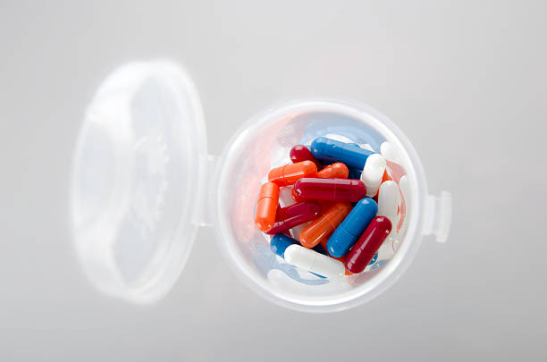 istock Bottle full of colored pills 507969512