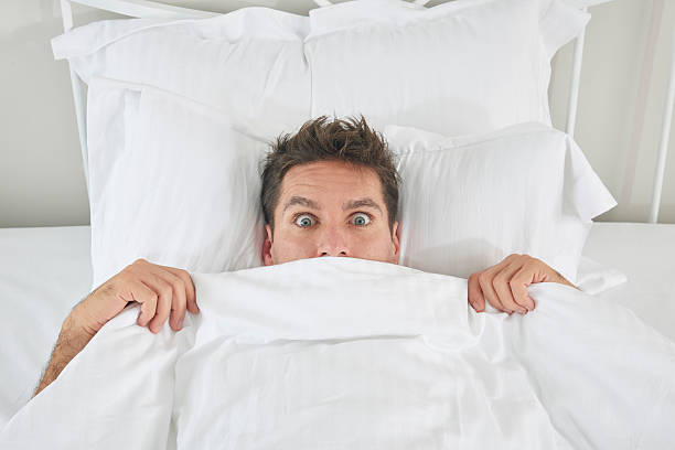 istock View of a man under the quilt 507971794