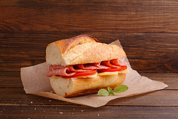 istock sandwich with tomato, sausage and cheese on a dark background 507971906