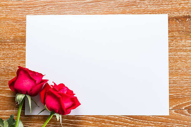 istock red rose and blank paper 507973186