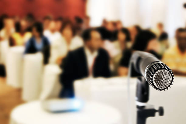 istock Microphone with out-of-focus audience 507982221