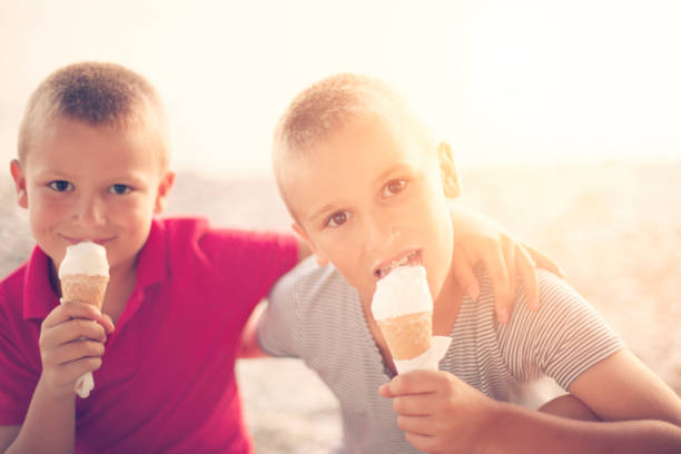 istock Boys enjoying ice cream cones 507982395