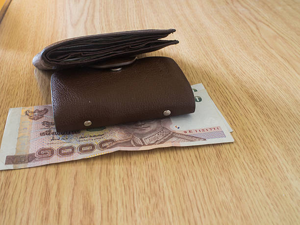 istock money in a brown wallet 507982869