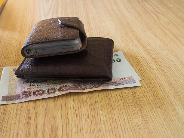 istock money in a brown wallet 507982873