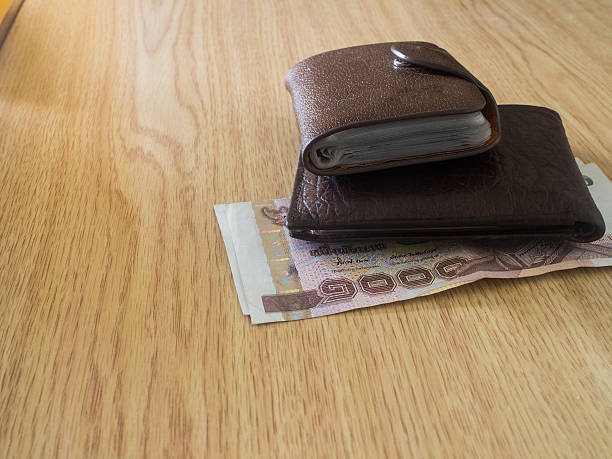 istock money in a brown wallet 507982875