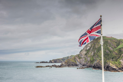 A British flag flying on the coast line in Ilfracombe, Devon. 