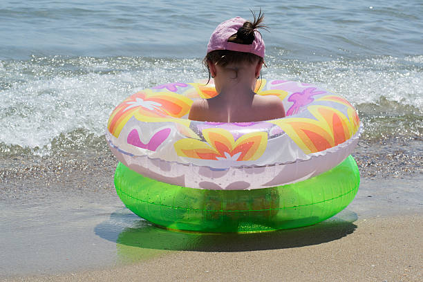 istock little girl on sea 507984023