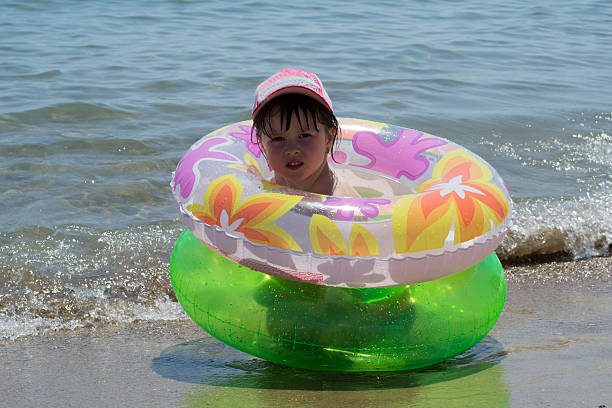 istock little girl on sea 507984053