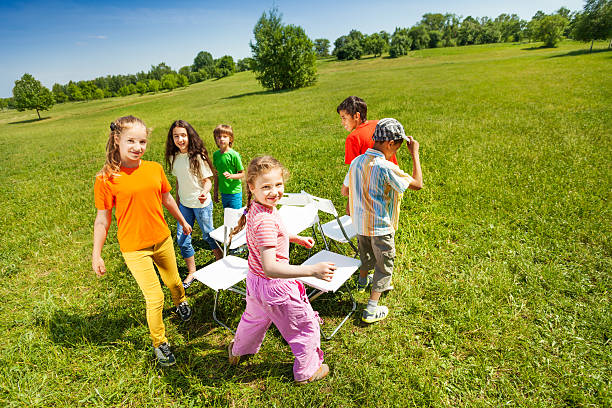 istock Children go around playing musical chairs outside 507985485