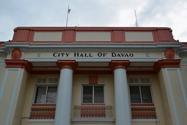 Low angle view of Davao city hall built in 1926 City hall of Davao imposing facade, low angle view. The Old City Hall, formerly the Municipal Building, was constructed in 1926 and is the city's landmark. davao city stock pictures, royalty-free photos & images