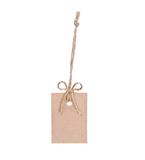 istock cardboard tag with ribbon isolated on white background 507986369