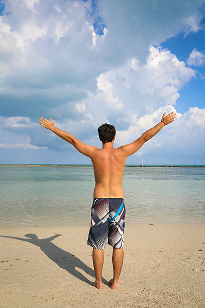 istock Young man on the beach 507986799