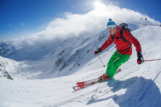 istock Skier skiing downhill in high mountains against sunset 507987741