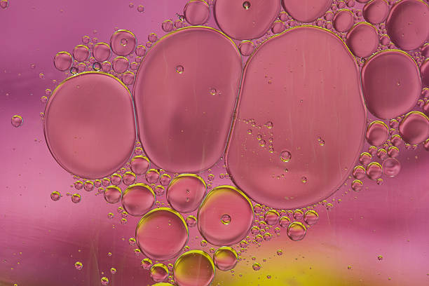 istock Abstract pattern of colored oil bubbles on water 507989307