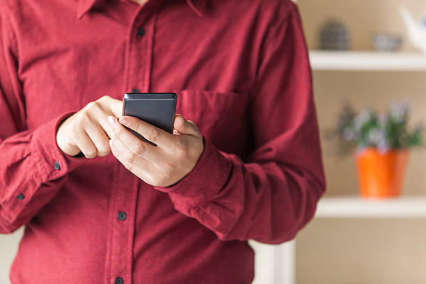 istock Businessman touch mobile phone in modern office 507994208