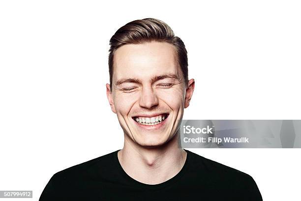 Portrait Of Young Man Smiling To Camera Stock Photo - Download Image Now - Men, Laughing, Smiling