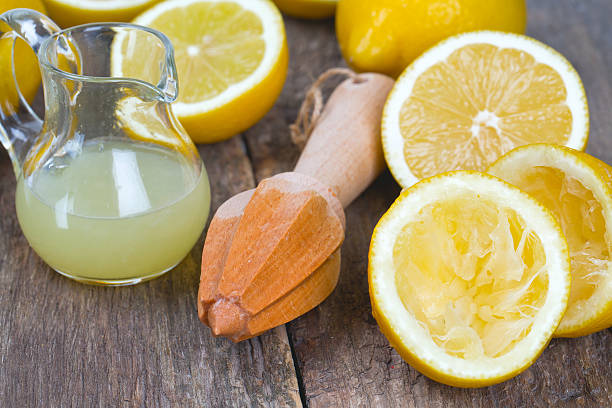istock lemon juicer on an old wooden table 507996916