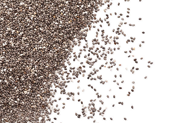 Chia seeds background Chia seeds background. DSRL studio photo taken with Canon EOS 5D Mk II and Canon EF 100mm f/2.8L Macro IS USM salvia hispanica plant stock pictures, royalty-free photos & images