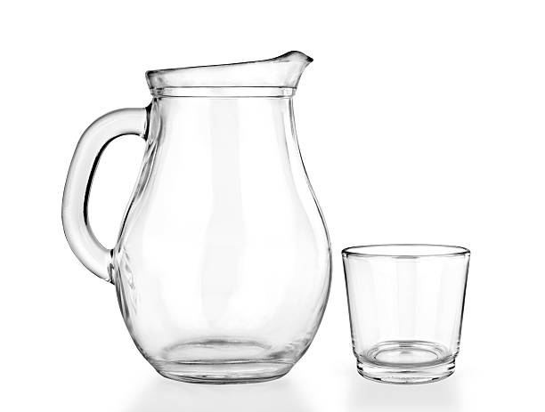 Empty jug and glass on a white Empty jug and glass on a white background. quench your thirst pictures stock pictures, royalty-free photos & images