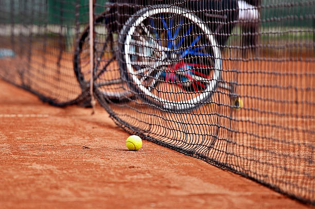 Wheelchair people on tennis court stock photo