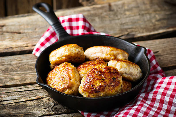 istock chicken cutlets on frying pan. 508002466