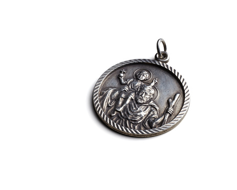 Saint Christopher good luck charm or medallion, showing Saint Christopher with Christ as a child on his shoulders.