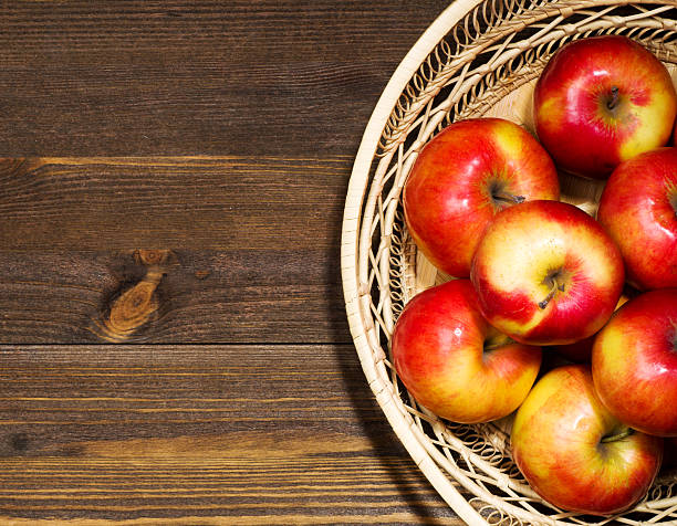 istock fresh apples on a wooden table in the background 508005458