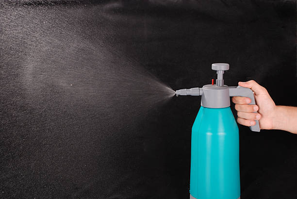istock Male hand holding spray bottle 508007998