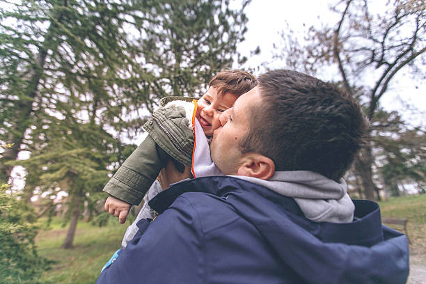 istock Father kissing his son 508009212